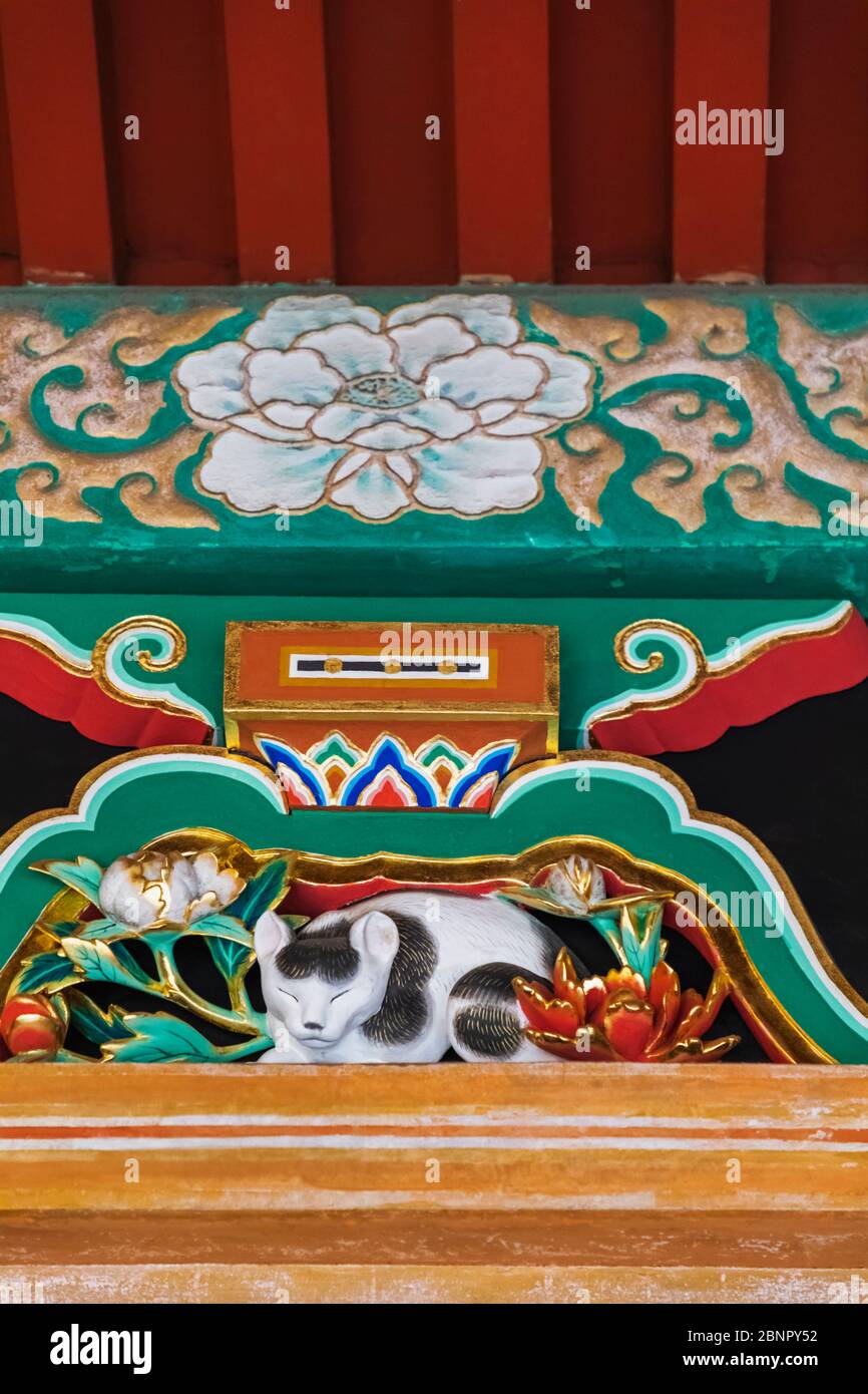 Japan, Honshu, Tochigi Prefecture, Nikko, Toshogu Shrine, Carved Painted Wooden Figure of 'Nemuri Neko' (Sleeping Cat) Stock Photo