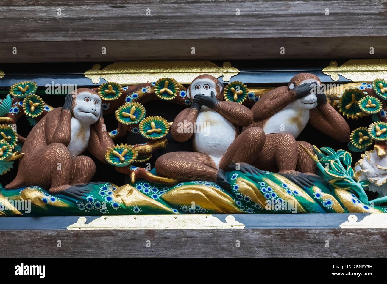 Japan, Honshu, Tochigi Prefecture, Nikko, Toshogu Shrine, The Famous Three Wise Monkeys, Hear No Evil, See No Evil, Speak No Evil Wooden Carving Stock Photo