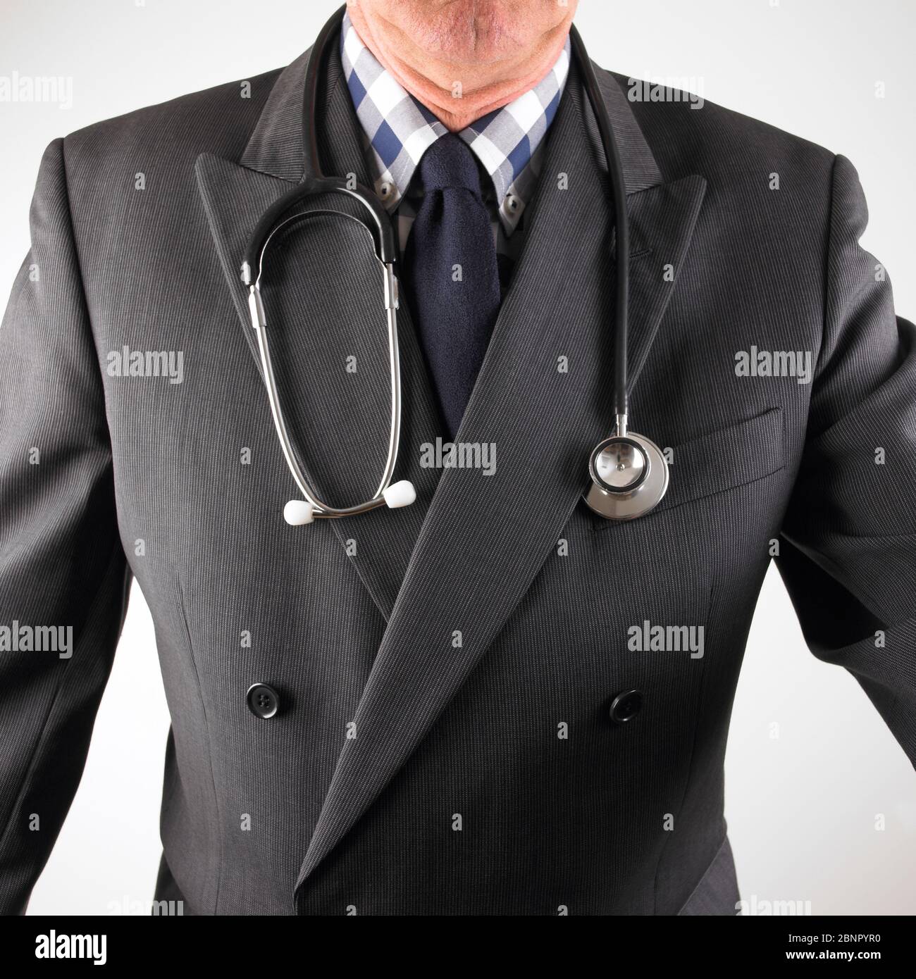 Male Medical consultant wearing suit with stethoscope around neck Stock Photo