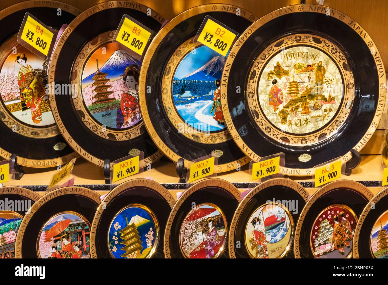 Souvenir shop display of souvenir plates depicting popular japanese