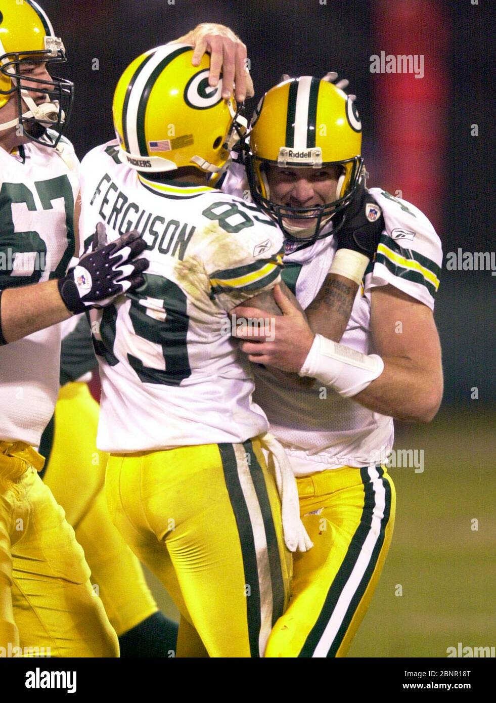 Green Bay Packers quarterback Brett Favre is congratulated by wide receiver  Robert Ferguson (89) and center Grey Ruegamer after second quarter  touchdown pass against the Oakland Raiders during 41-7 victory in a NFL  football game at Network