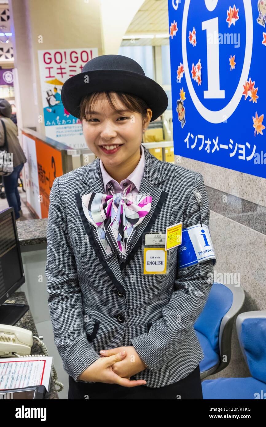 Japan, Honshu, Tokyo, Asakusa Station, Tobu Railways, Tobu Nikko Line, Bi-lingual Female Information Counter Assistant Stock Photo