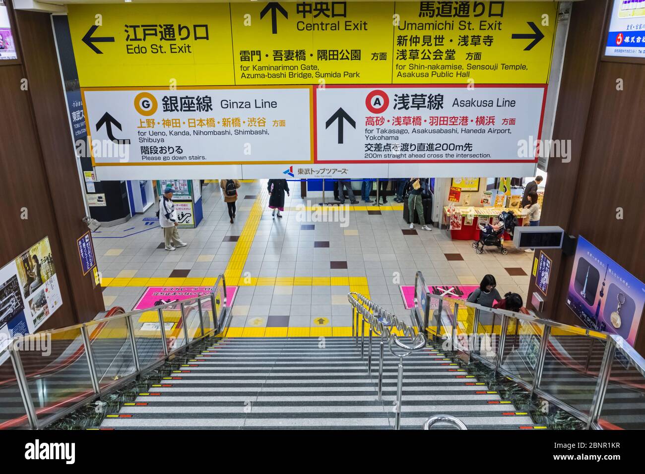 Japan, Honshu, Tokyo, Asakusa Station, Tobu Railways Station, Exit Stairway and Bi-lingual Directions Signs Stock Photo