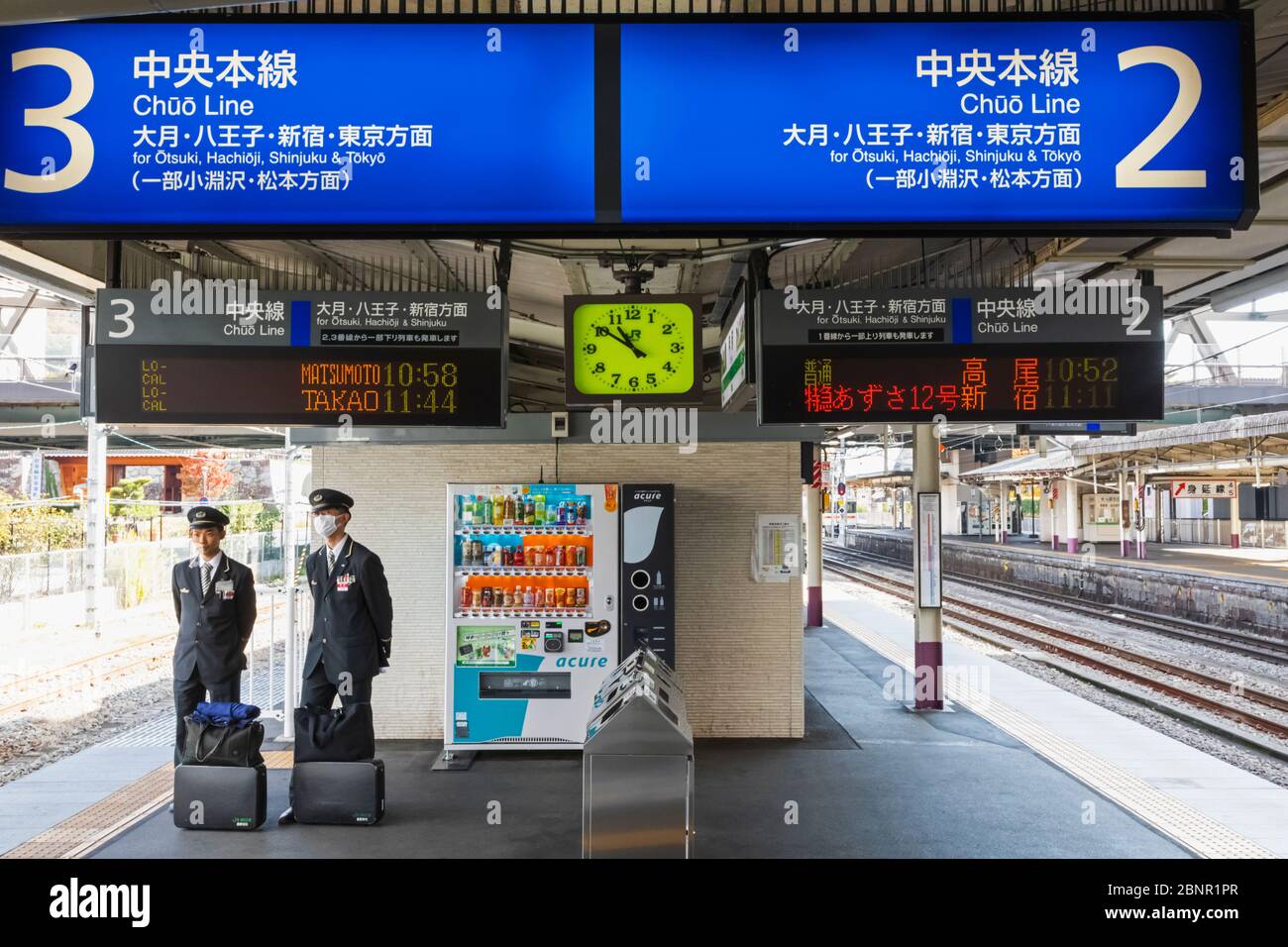 Japan, Honshu, Yamanashi, Kofu, Kofu Station, Japan Railway (JR) Station, Train Guards on Platform Stock Photo