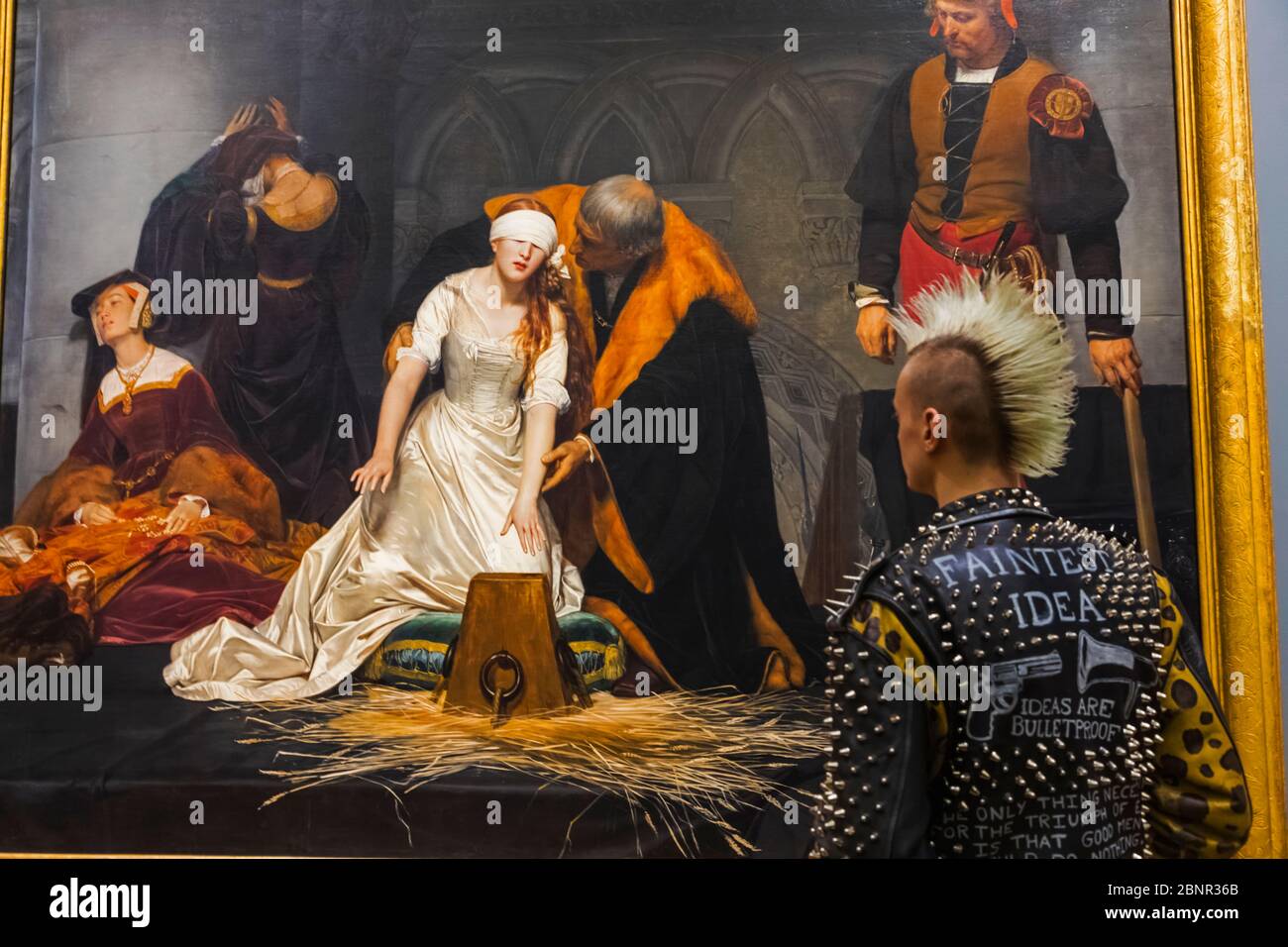 England, London, Trafalgar Square, The National Gallery, Punk Visitor in Front of Painting  titled 'Execution of Lady Jane Grey' by Paul Delaroche Stock Photo