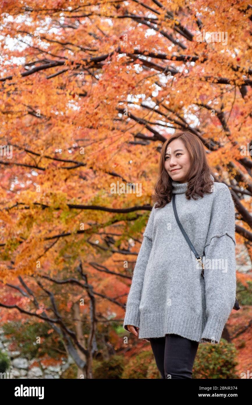 Portrait image of beautiful asian woman enjoyed standing in the garden ...