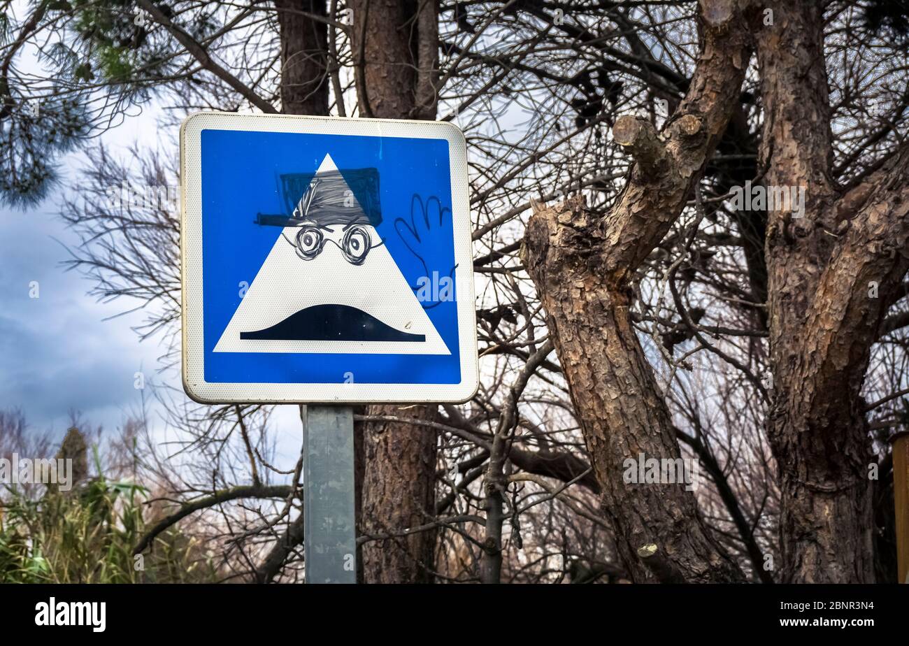 Intervened street sign at Bages. Located in the Narbonnaise en Méditerranée Regional Nature Park. Stock Photo