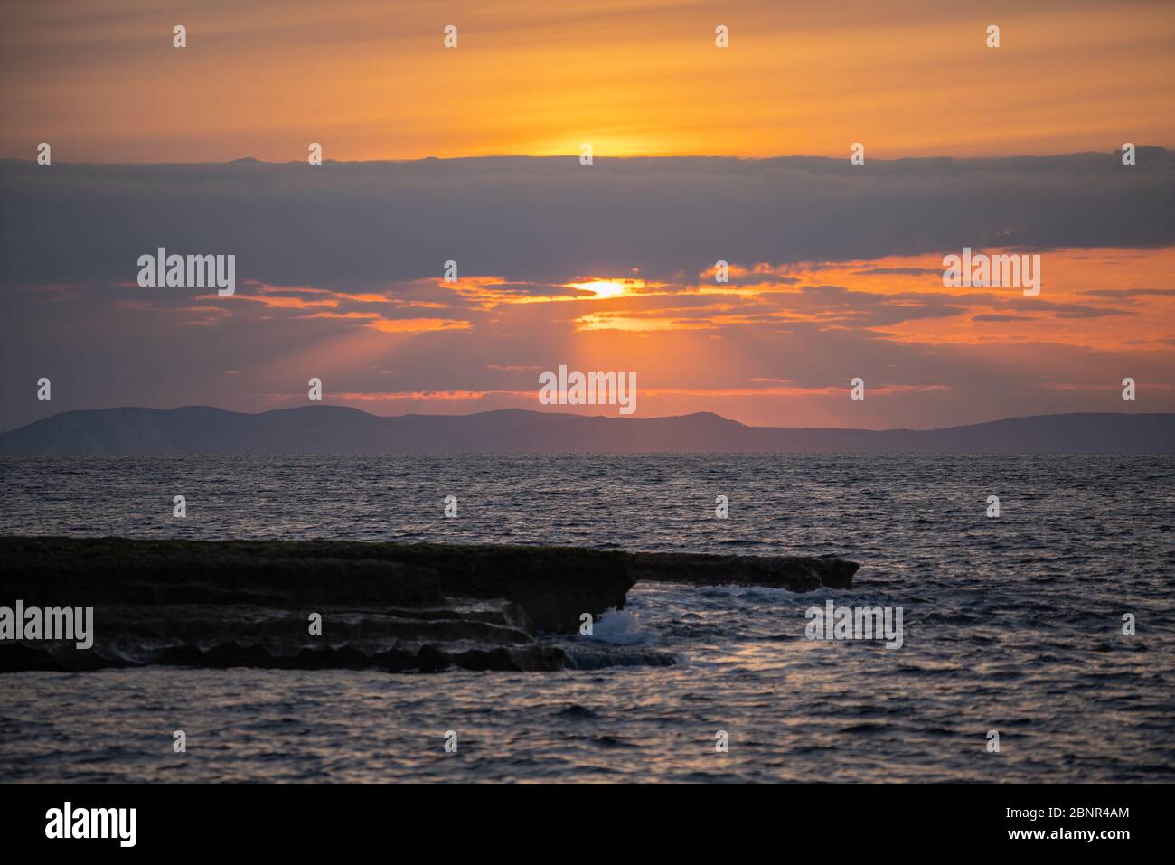 Portland Bill, Dorset, UK. 16th MAY, 2020. UK Weather. Colourful and calm sunrise down on the south coast of Dorset. Credit: Dan Tucker/Alamy Live Stock Photo