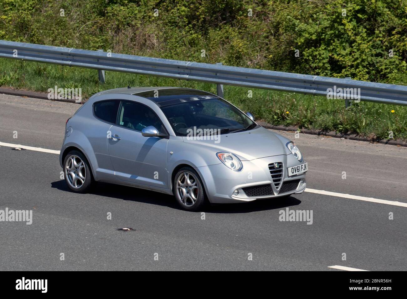 Alfa Romeo Mito 1.4 TB MultiAir; Vehicular traffic moving vehicles, driving vehicle on UK roads, motors, motoring on the M6 motorway highway Stock Photo