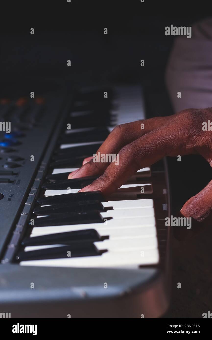 Playing the Electronic Keyboard in Music Recording studio close up on