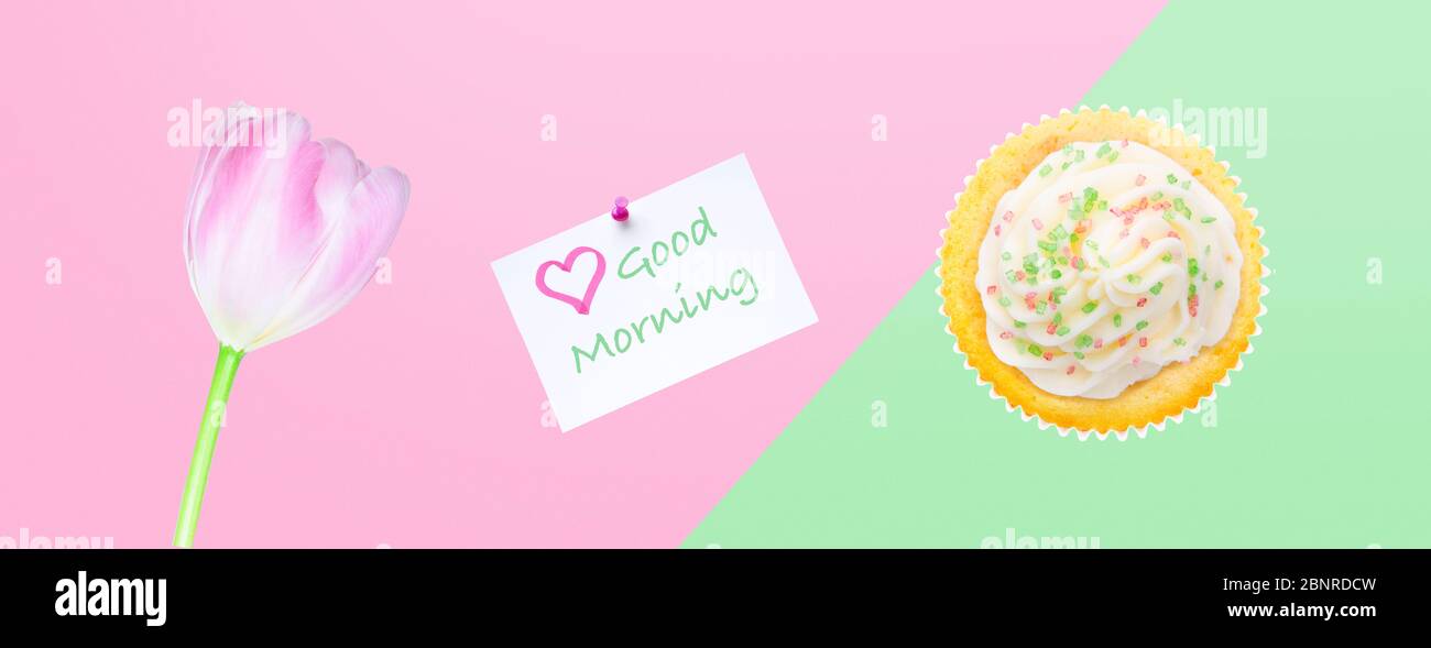 'Good morning' greeting with flowers and cupcake Stock Photo