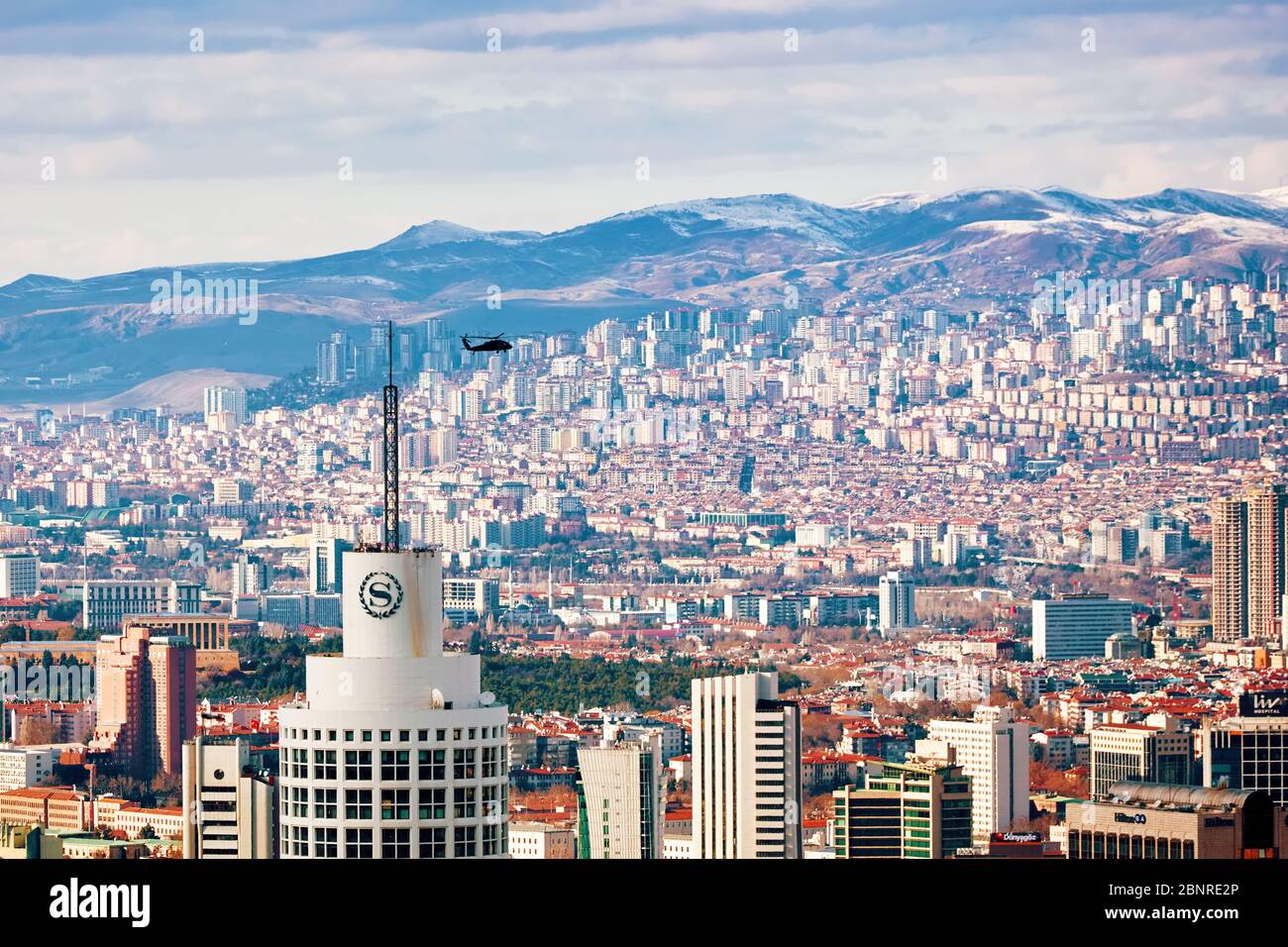 March, 2020 - Ankara, Turkey: Panoramic cityscape of Ankara, Turkey with a helicopter flying over the city. View from Cankaya district. Stock Photo