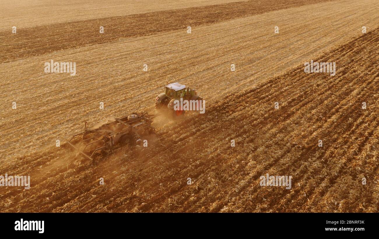 Cultivation of the agricultural field after harvesting Stock Photo - Alamy