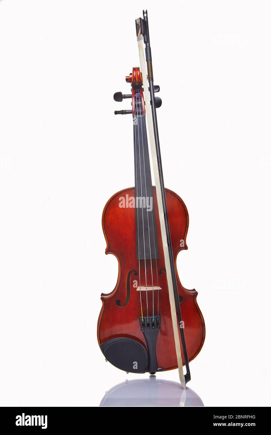 Violin with bow isolated on a white background. Musical concept. Stock Photo