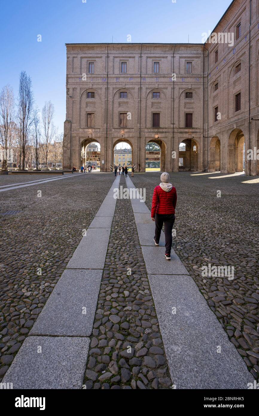 One person walking around Palazzo Pilotta. Parma, Emilia Romagna, Italy, Europe. Stock Photo