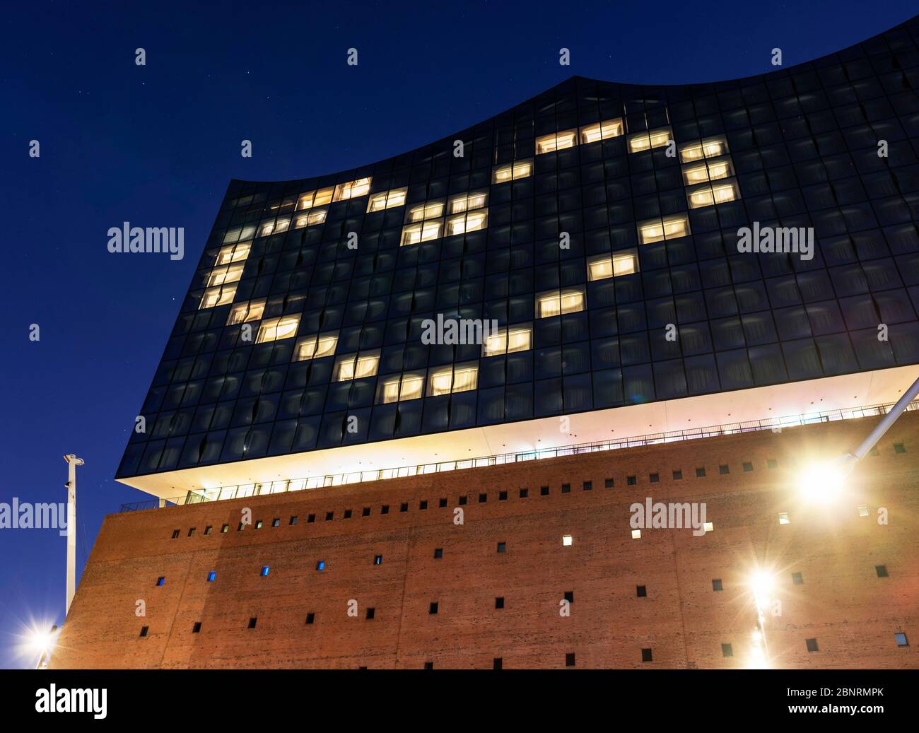 Elbphilharmonie with heart from illuminated hotel rooms as a sign of the Corona crisis, Hafencity, Hamburg, Germany Stock Photo
