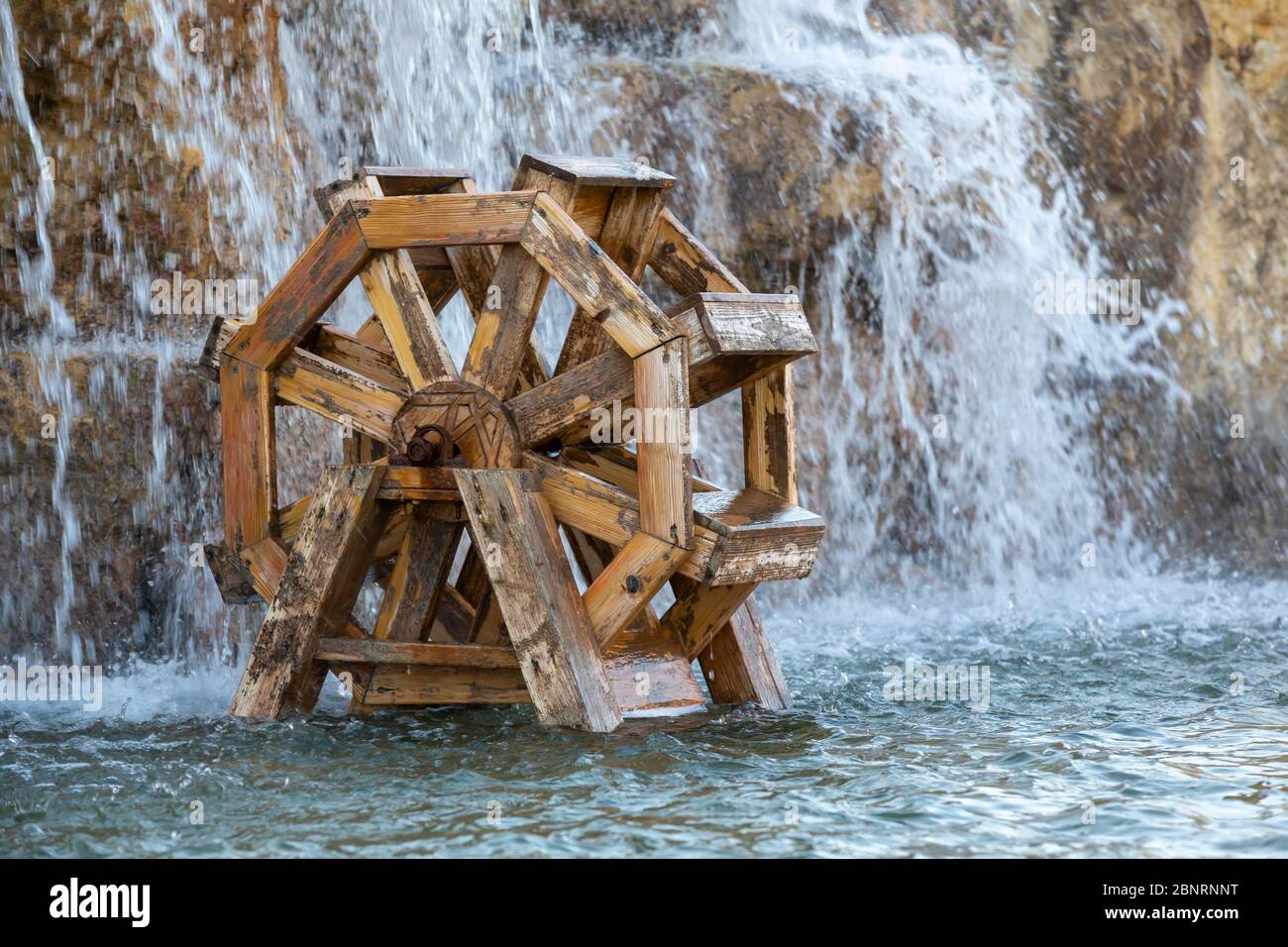 Wooden  watermill on the pool Stock Photo