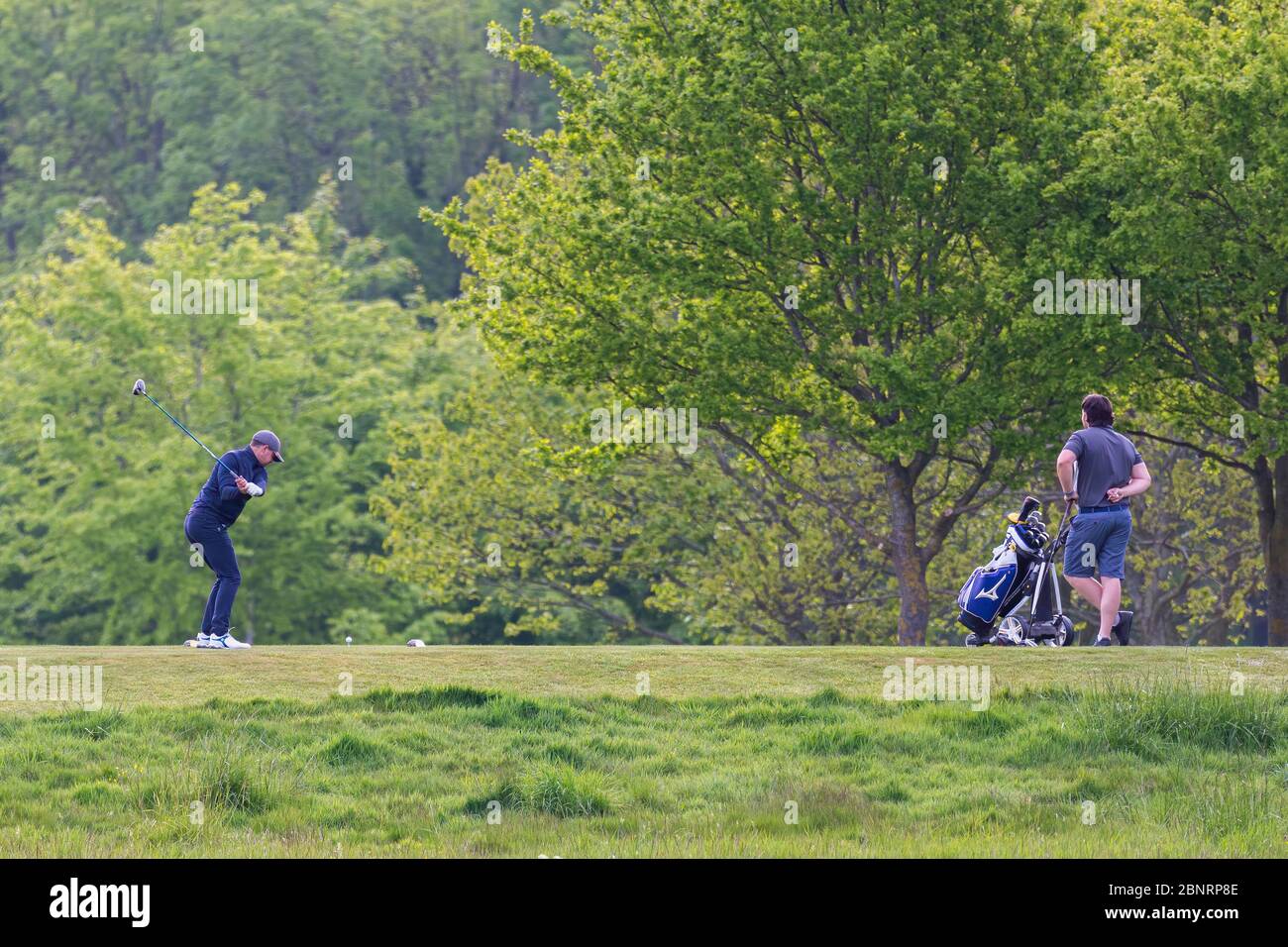 May 16th 2020. Rochester and Cobham Park Golf club. Two golfers two days after the easing of lockdown measures due to the coronavirus tee off for a ro Stock Photo