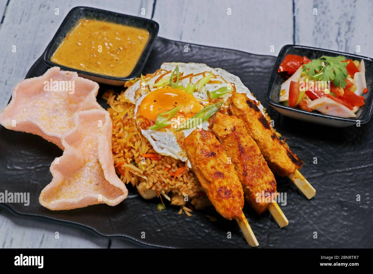 Nasi goreng, literally meaning fried rice in Indonesian, serve with