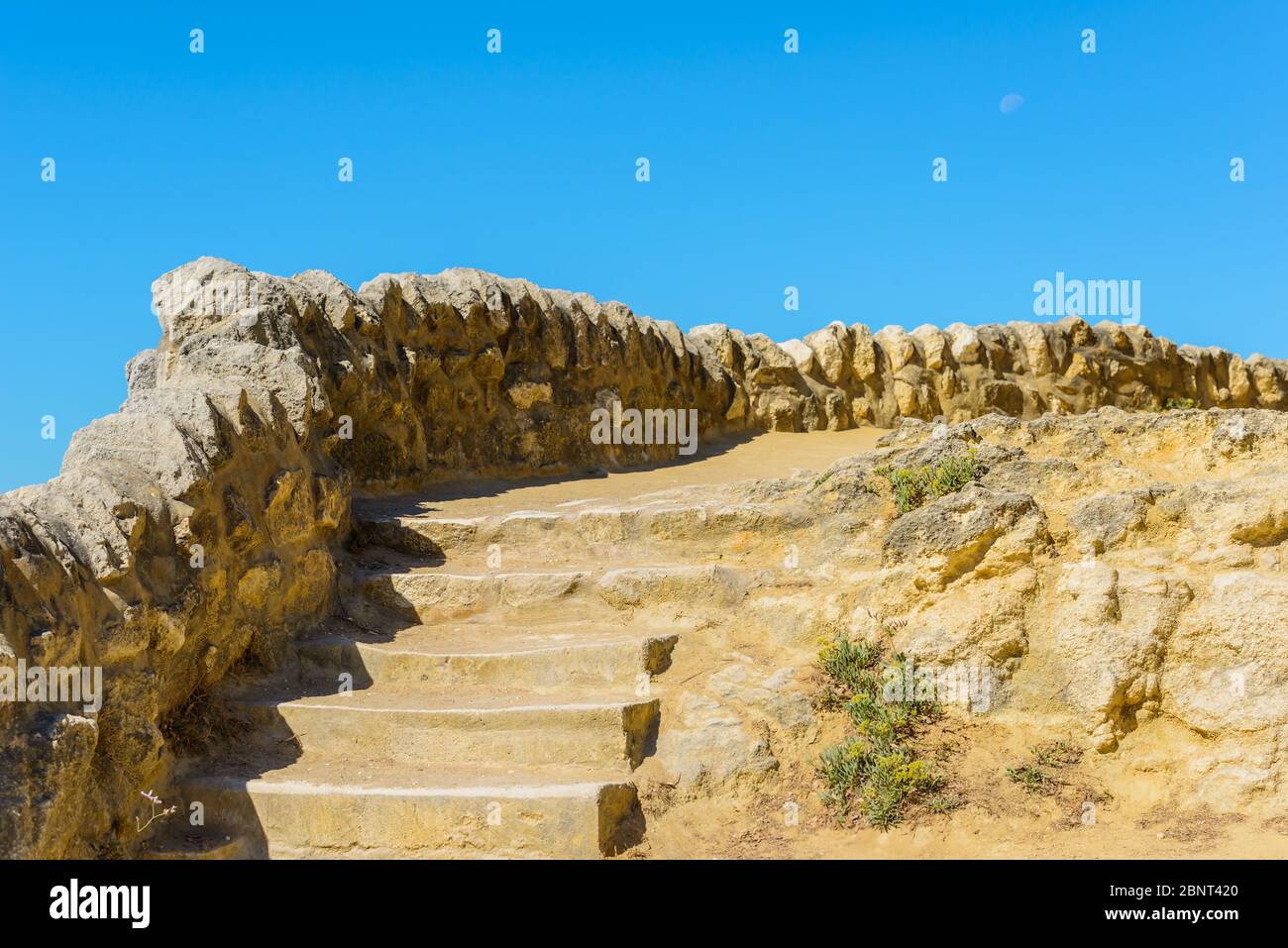 Saint-Palais-sur-Mer, France: Stone wall and steps on the coastal footpath between Plage du Bureau and Plage du Platin (and Le Pont du Diable). Stock Photo