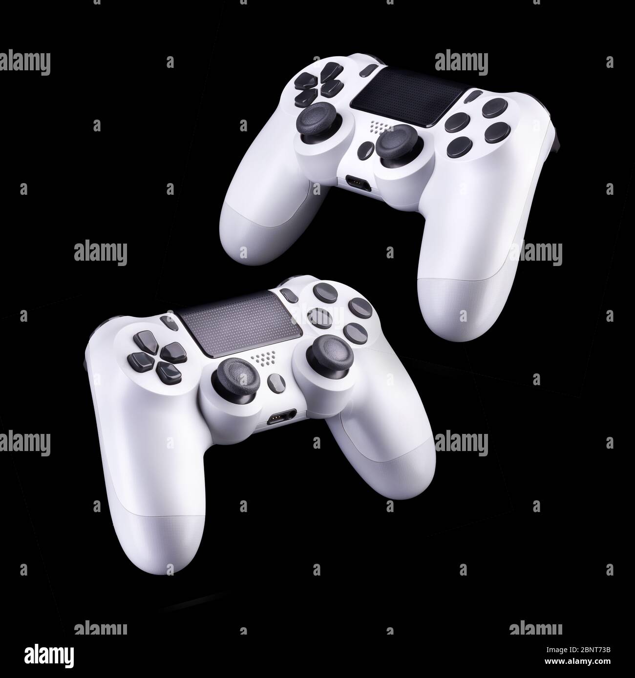 Set of white video game joysticks gamepad isolated on a black ...