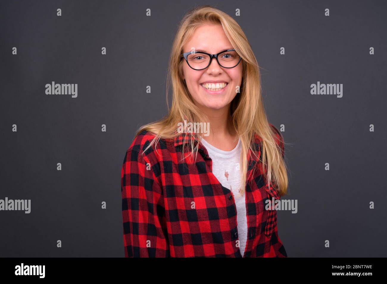 Young blond student smiling hi-res stock photography and images - Alamy