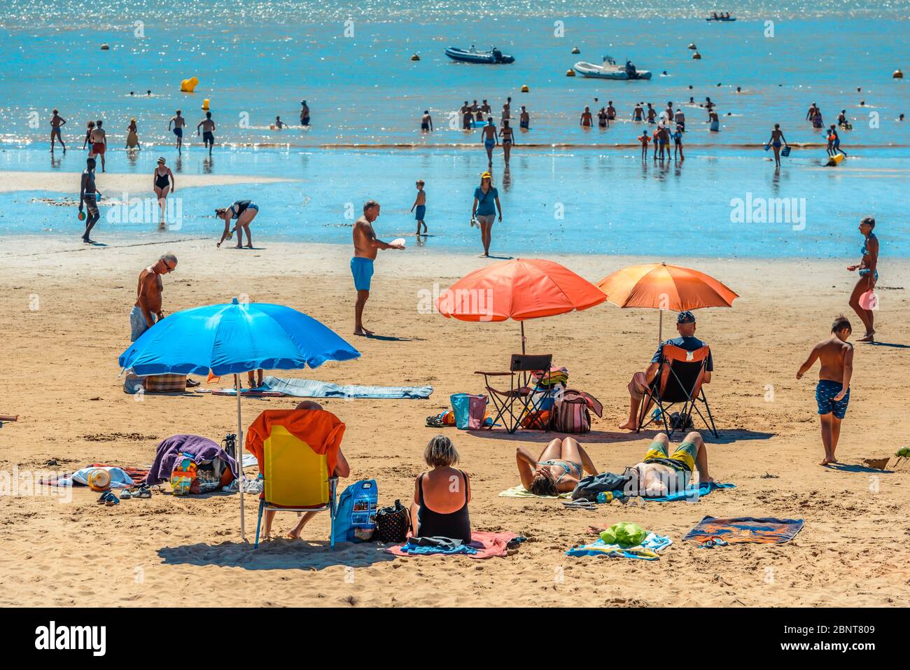 SaintPalaissurMer, France Holidaymakers soak up the sun on the Plage du Bureau beach in the SaintPalaissurMer, France Holidaymakers soak up the sun on the Plage du Bureau beach in the