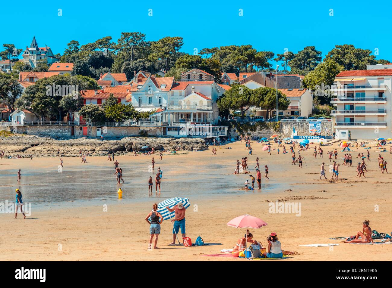 Saint-Palais-sur-Mer, France: Holidaymakers soak up the sun on the Plage du  Bureau beach in the town centre in high season Stock Photo - Alamy