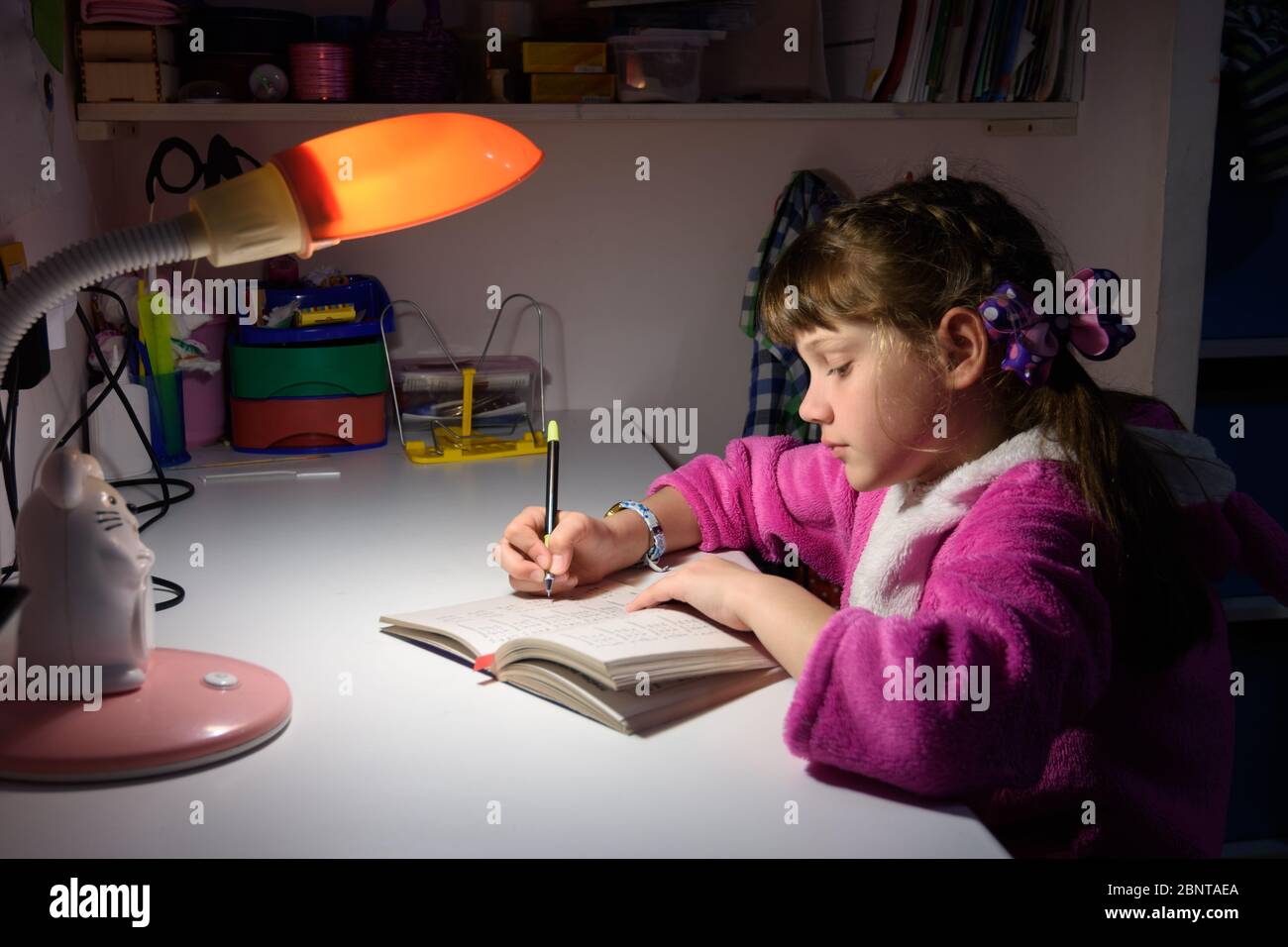 a-girl-does-homework-late-at-night-stock-photo-alamy