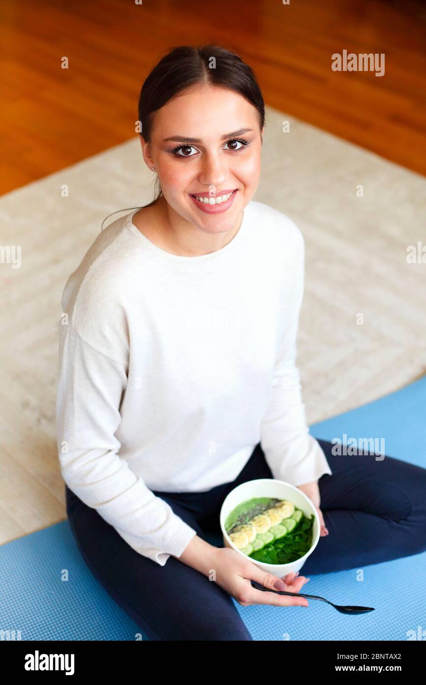 Young girl sitting on the floor crossed legged hi-res stock photography ...