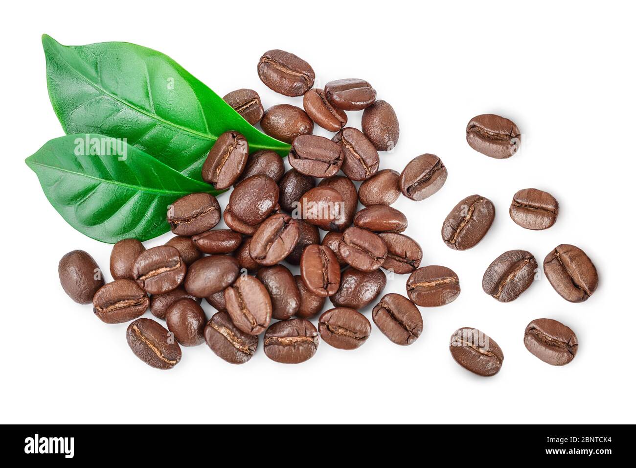 Heap of roasted coffee beans with leaves isolated on white background ...
