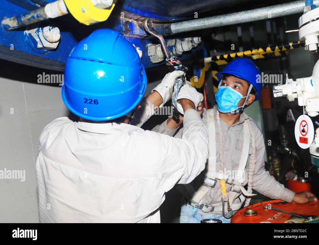 (200516) -- KOH KONG, May 16, 2020 (Xinhua) -- Photo taken on March 24, 2020 shows Chinese workers maintaining equipment at lower Stung Russei Chrum hydropower station in Koh Kong province, southwestern Cambodia. Located in the jungles in Koh Kong province, southwestern Cambodia, the Chinese-built lower Stung Russei Chrum hydropower station has kept normal running since the outbreak of COVID-19, powering this Southeast Asian nation to brave uncertainties brought by the pandemic. TO GO WITH 'Feature: China-constructed hydroelectric station powers Cambodia's development against COVID-19' (China Stock Photo