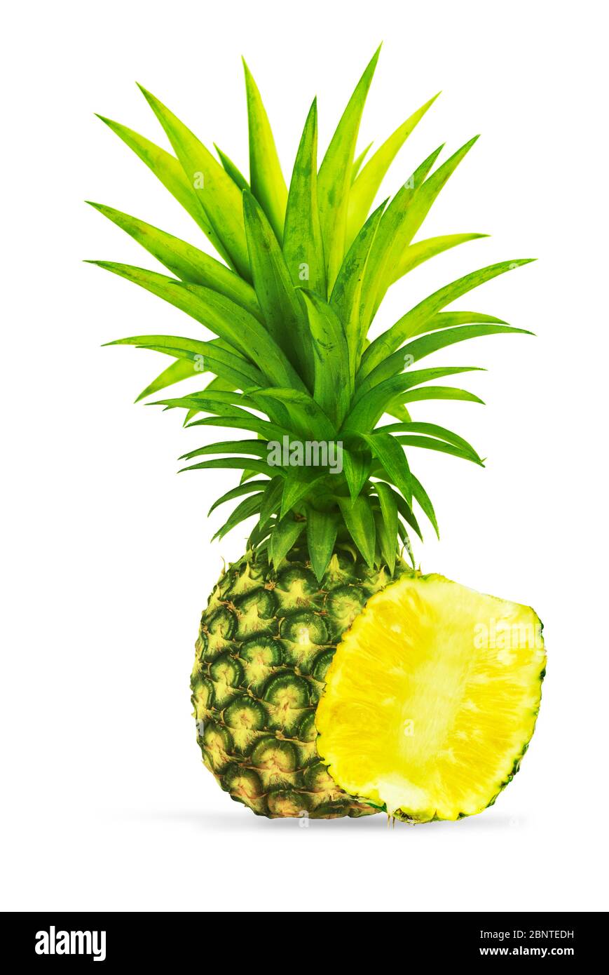 Whole pineapple with slice on clean white background Stock Photo