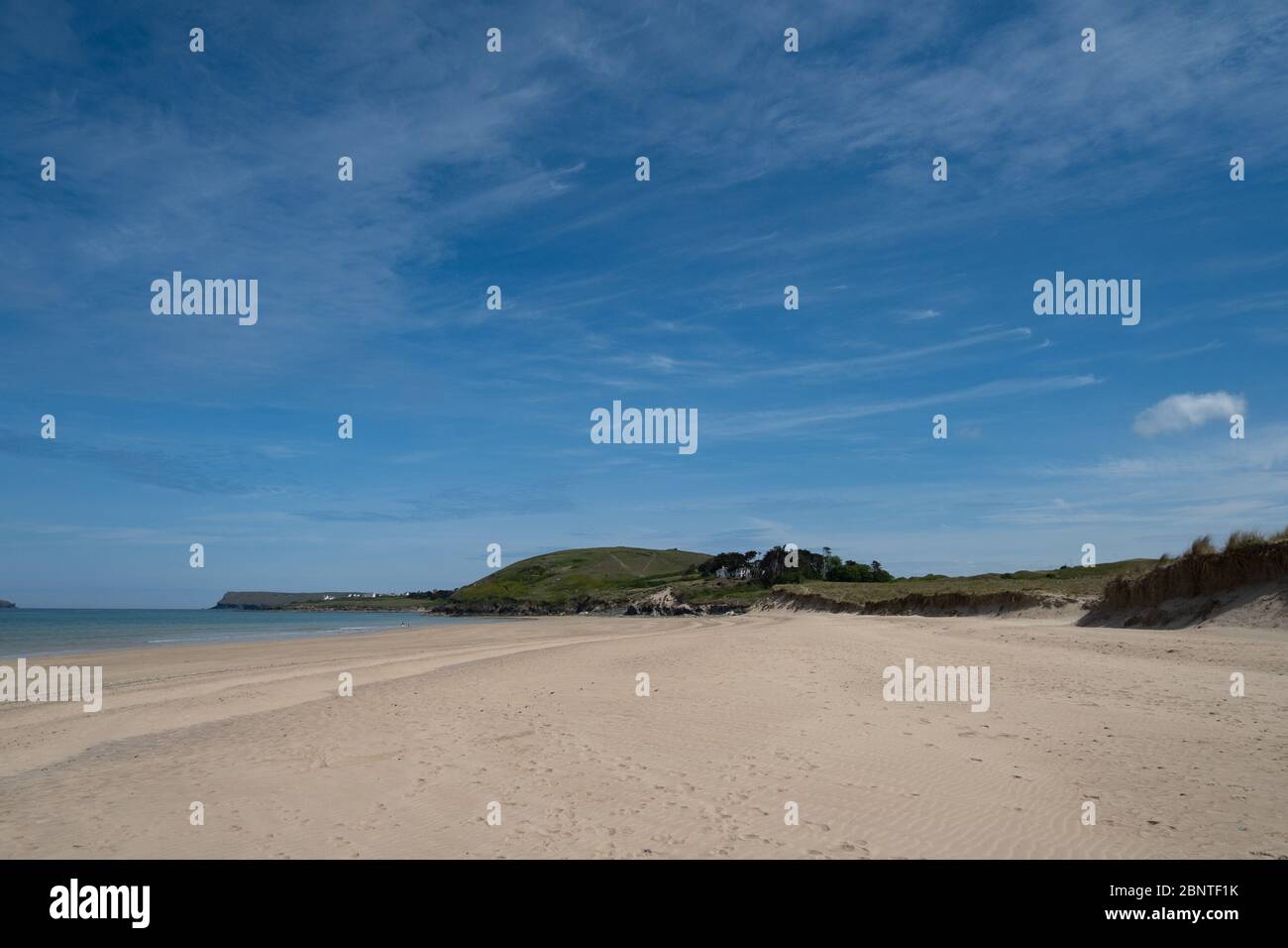 Rock, Cornwall, UK. 16th May 2020. UK Weather. The beach at Rock was still quiet today, despite the blue skies and sunshine. Credit CWPIX / Alamy Live News. Stock Photo