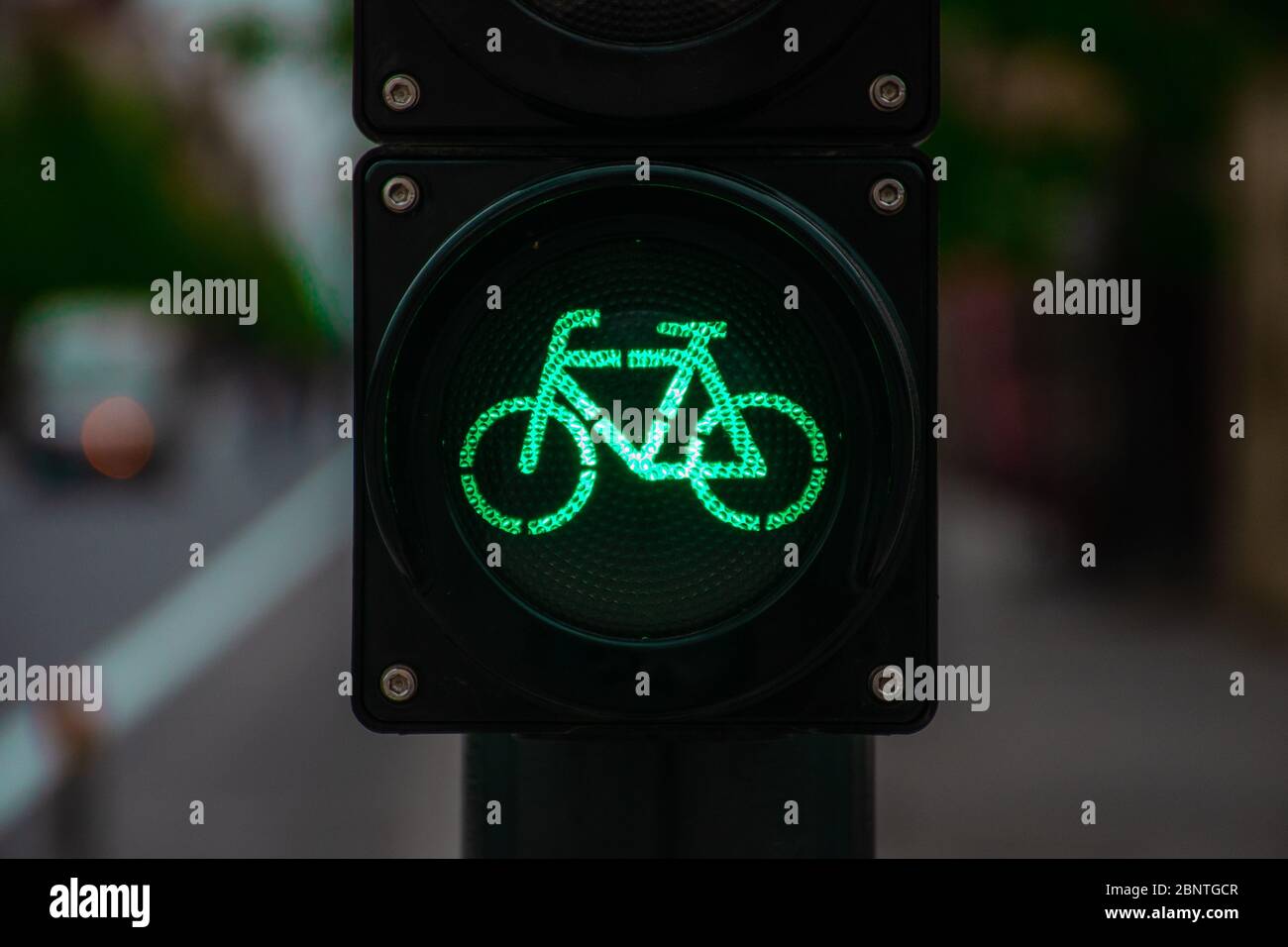 Sustainable transport. Bicycle traffic signal, green light, road bike