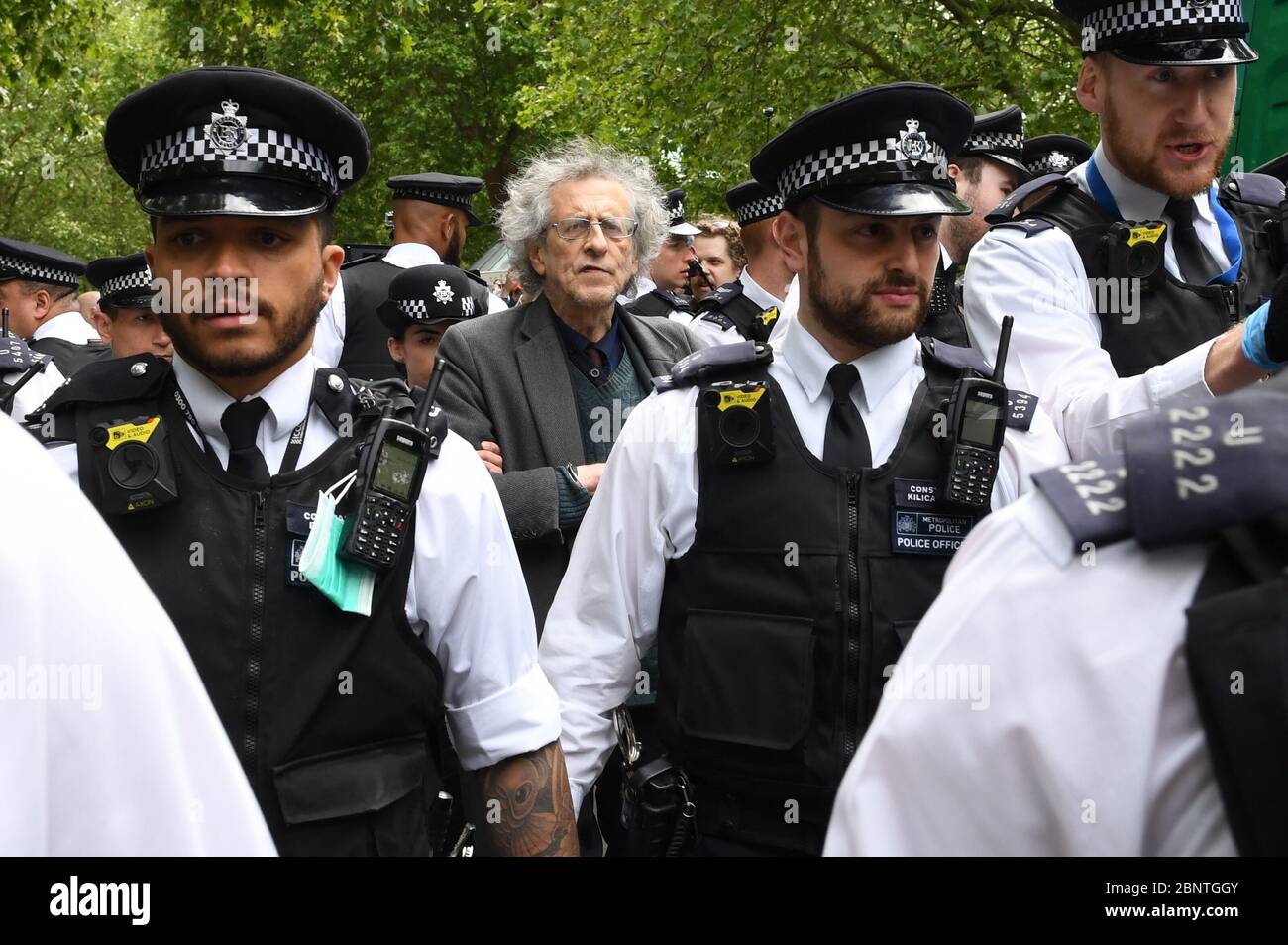 Police lead away Piers Corbyn, brother of former Labour leader Jeremy Corbyn, as protesters gather in breach of lockdown rules in Hyde Park in London after the introduction of measures to bring the country out of lockdown. Stock Photo