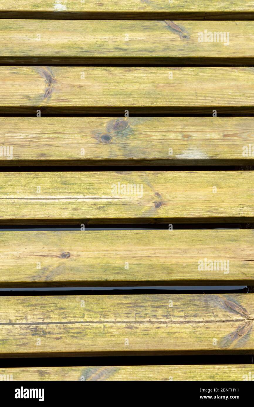 Closeup of flooring grate made of green pressure treated  ( chemical pressure impregnated ) wooden boards Stock Photo