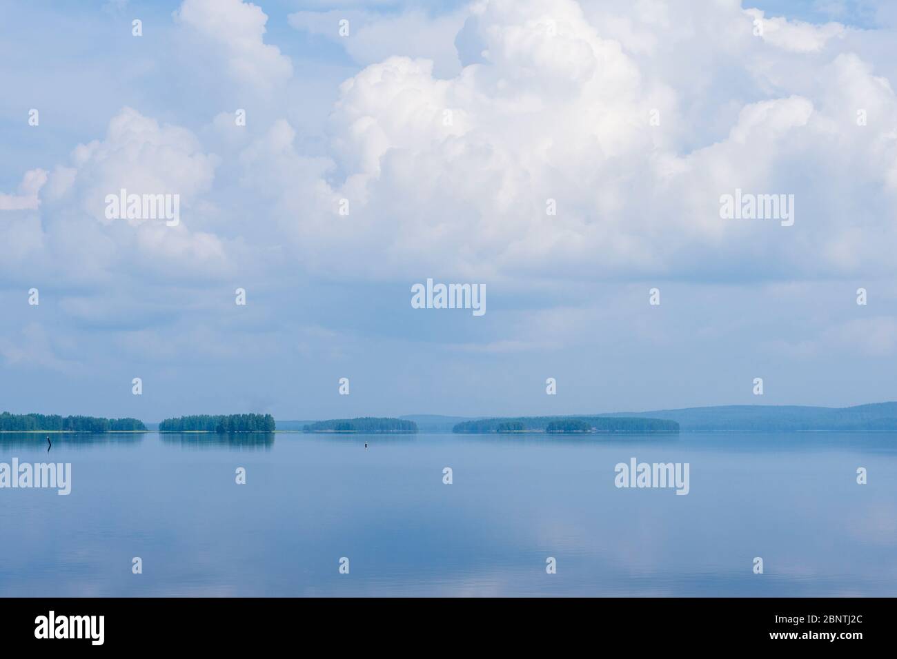 View of flat calm Lake Pohjois-Konnevesi at Summer , Finland Stock Photo