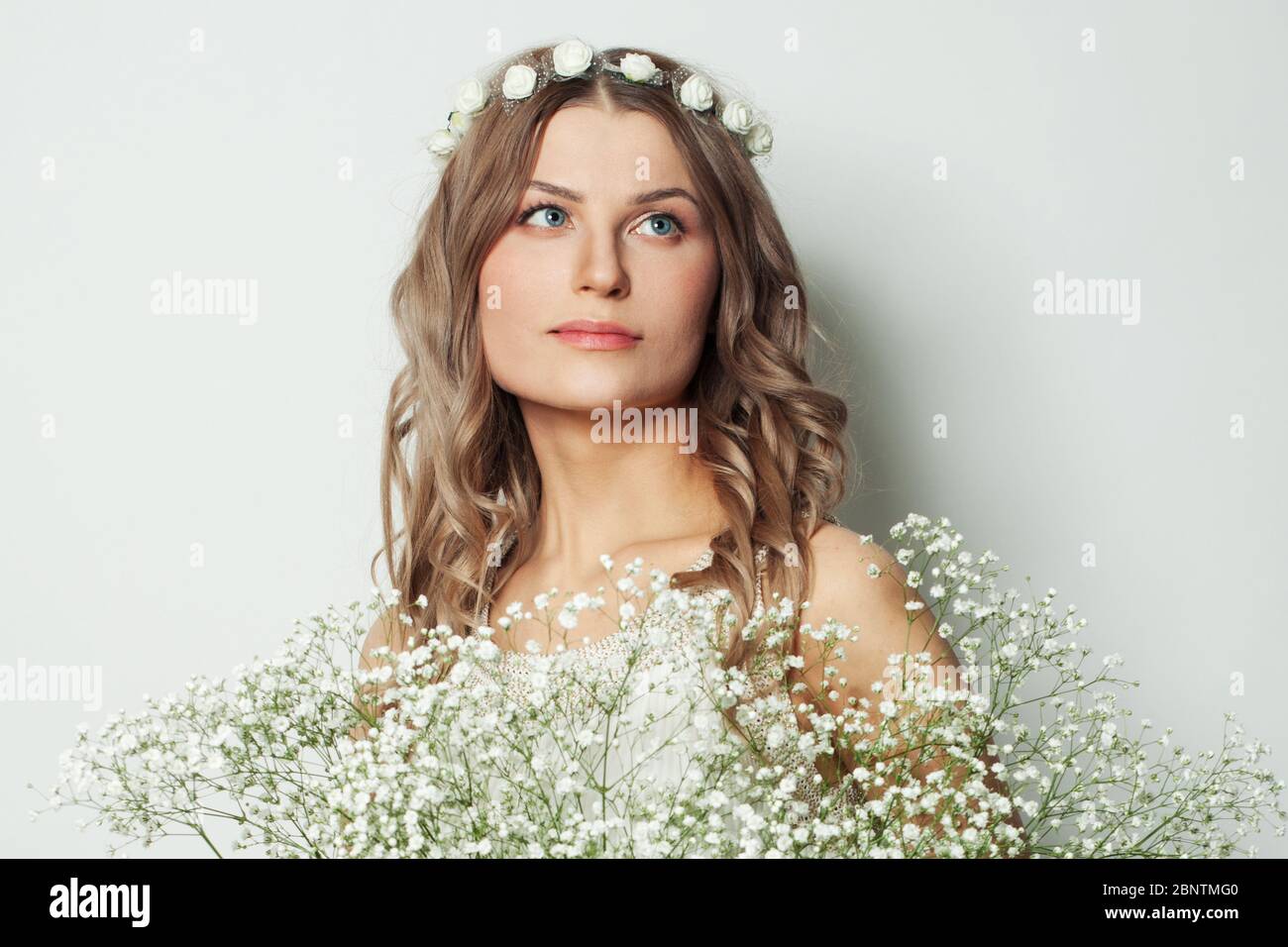 Beautiful woman with flowers on white background portrait Stock Photo ...