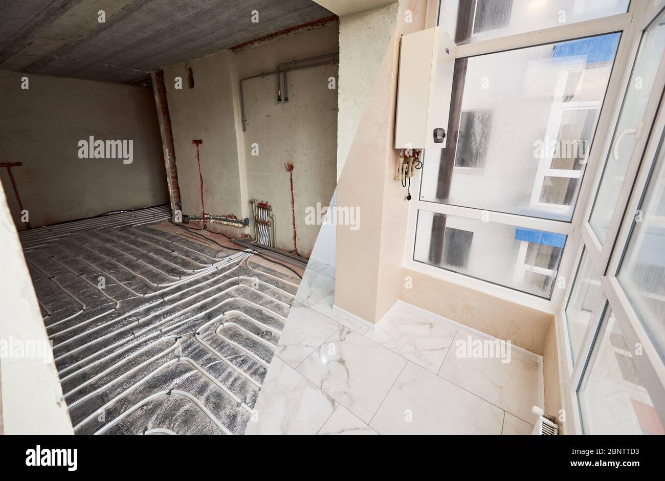 Comparison of new renovated apartment with modern plastic window and marble floor and old place with underfloor heating pipes. Apartment room before and after refurbishment. Concept of home renovation Stock Photo