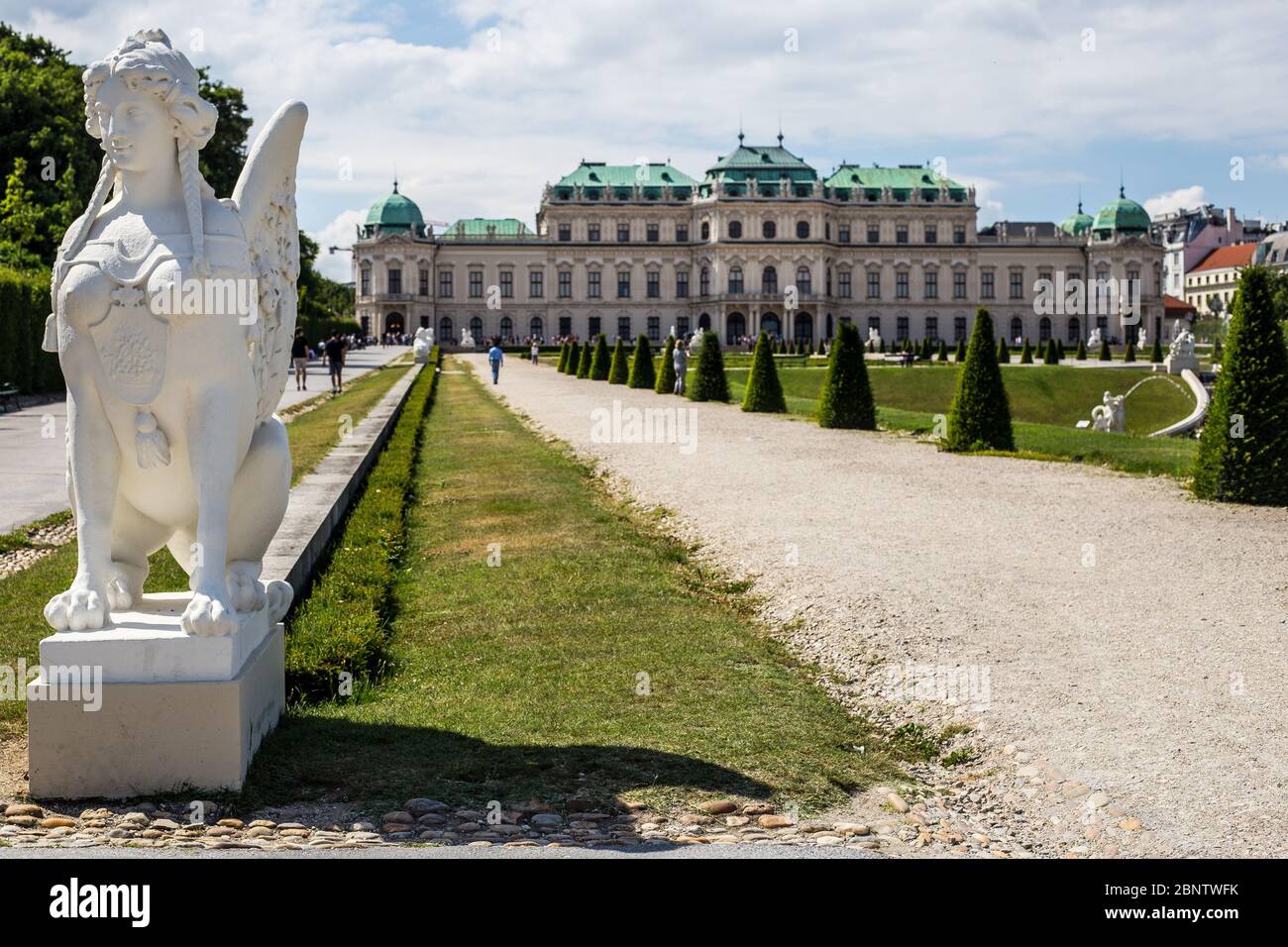 Vienna, Austria - June 19, 2018: View of Sphinx Sculpture and Upper Belvedere Palace and Garden on a Summer Day Stock Photo