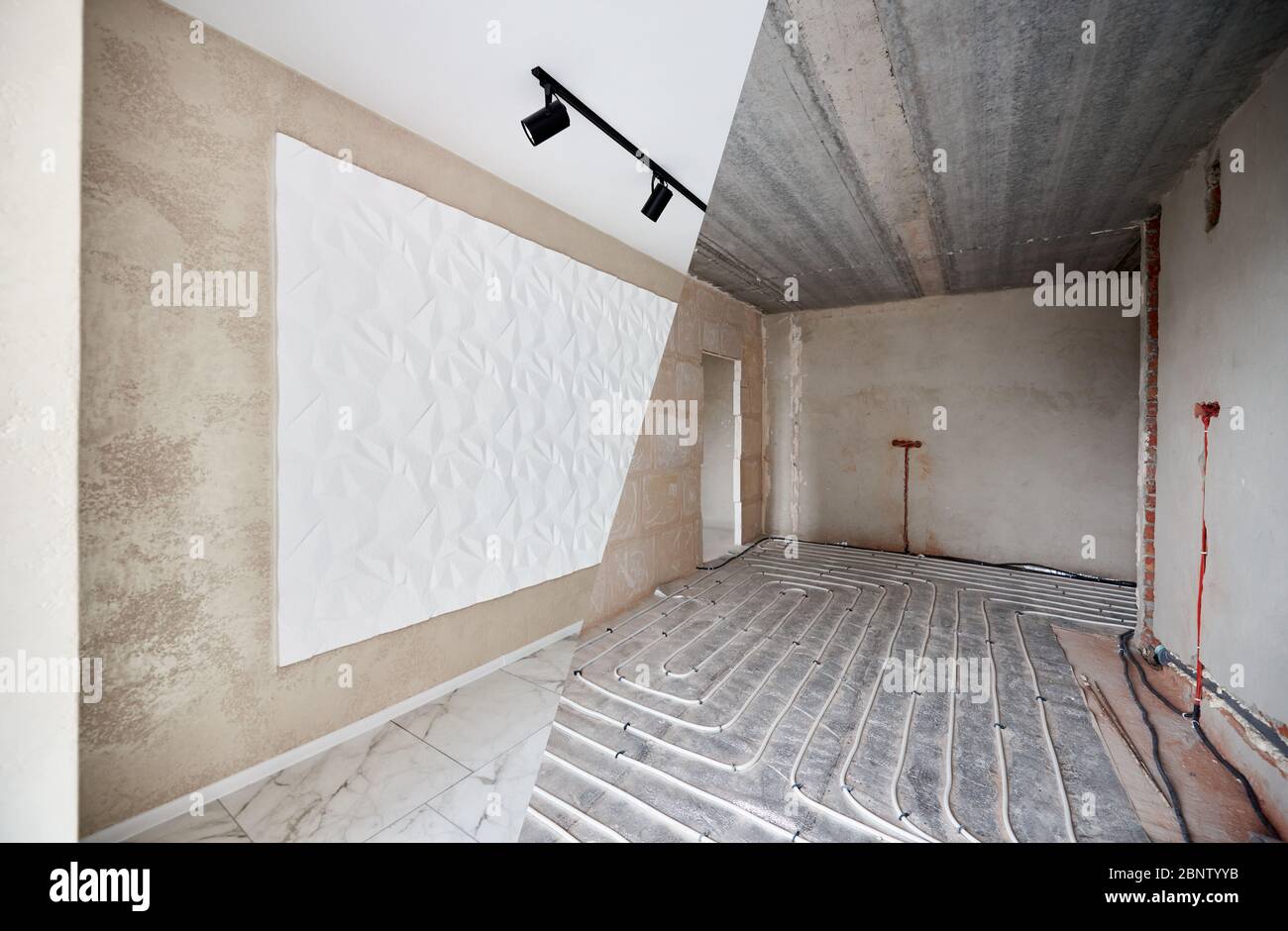 Big spacious room in apartment before and after repairs. Empty walls, 3D panel texture, modern plastering, spotlight chandelier, floor heating pipe system, white shiny tiles on floor Stock Photo