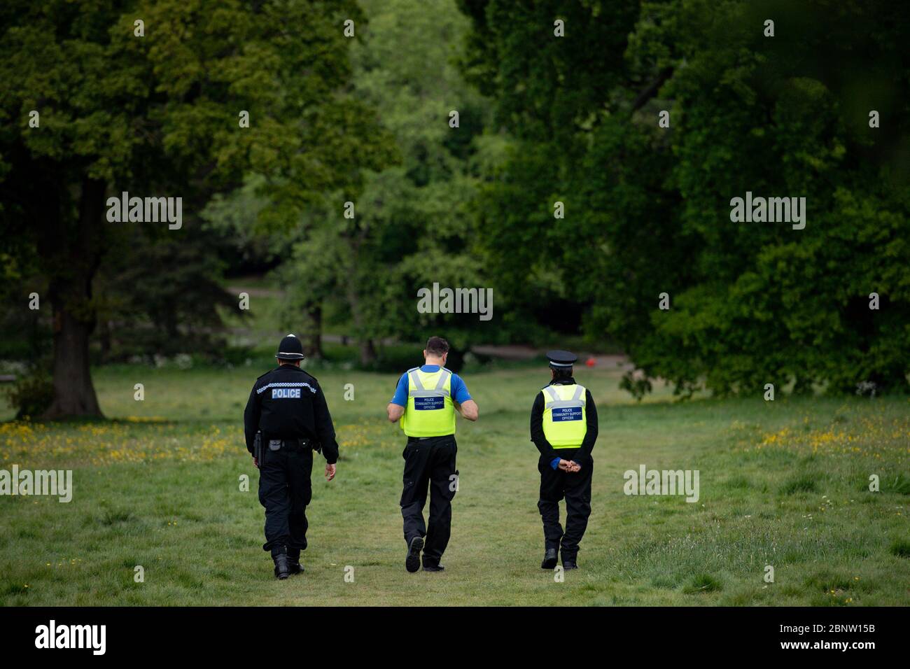 Police officers monitor Highbury Park in Birmingham, after the introduction of measures to bring the country out of lockdown. Stock Photo
