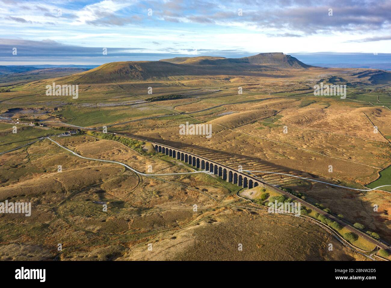 Aerial of The Ribblehead Viaduct a Grade II listed structure, the Viaduct runs the Settle to Carlisle railway route in North Yorkshire, England. Stock Photo