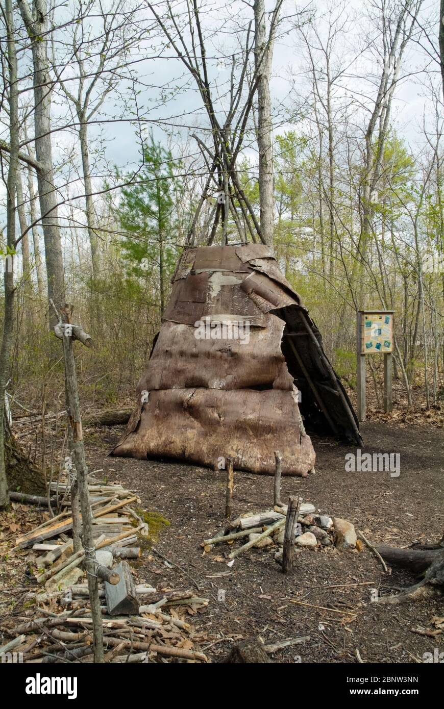 A wigwam at Sandy Point Discovery center in Stratham, New Hampshire. Wigwams are dome-shaped huts or tents that were used by Native American tribes. Stock Photo