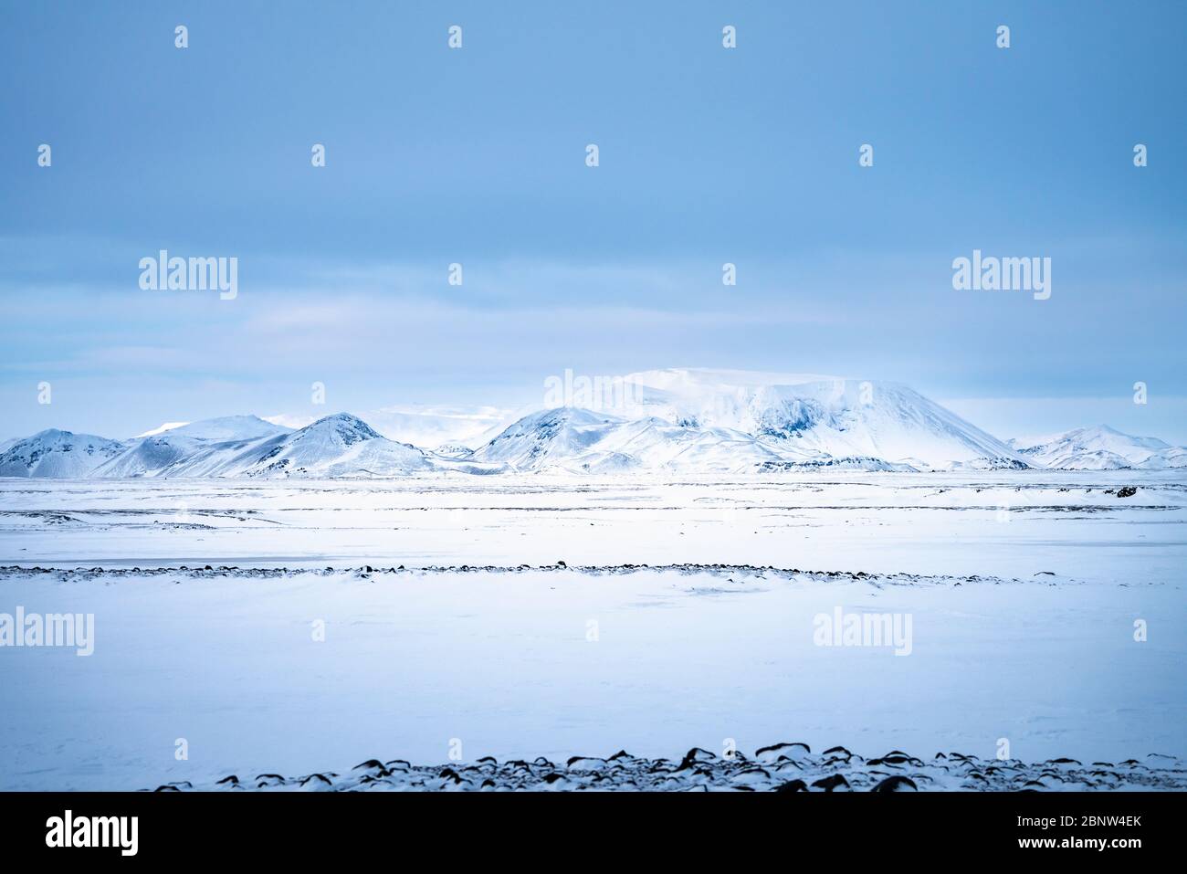 Snow covered mountains and Icelandic volcanic landscape in winter near Lake Myvatn, north east Iceland Stock Photo