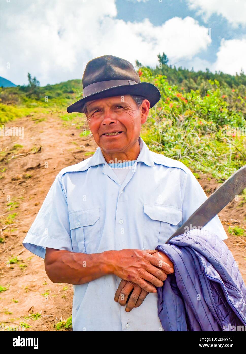 Quichuan landowner on Cotacachi Volcano & Machete Stock Photo