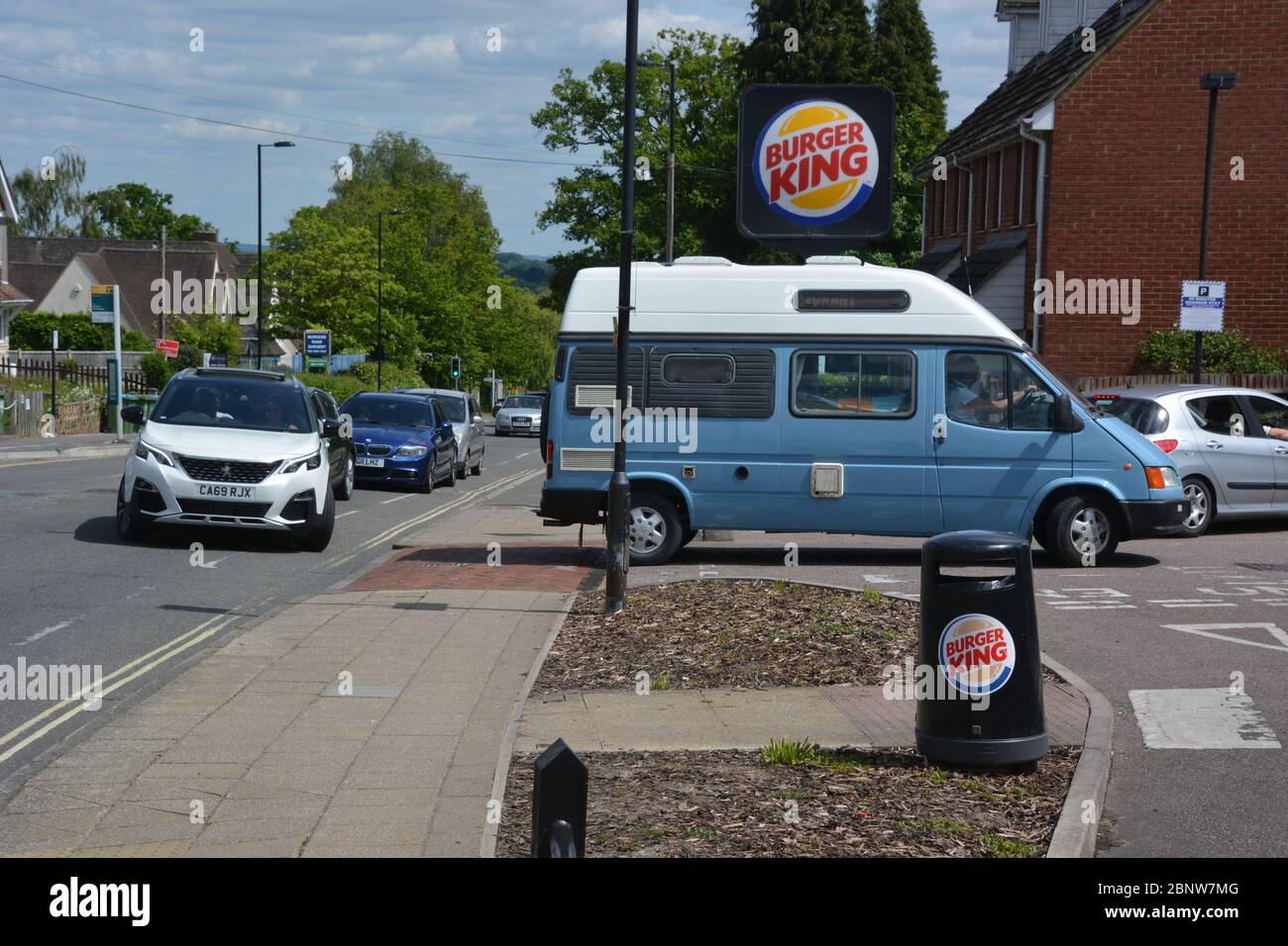 Cars queuing for the newlyreopened Burger King drivethrough in