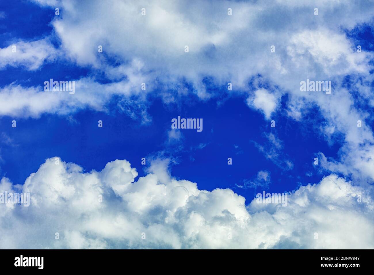Bright deep blue sky beautiful clouds and fresh air for background Stock Photo