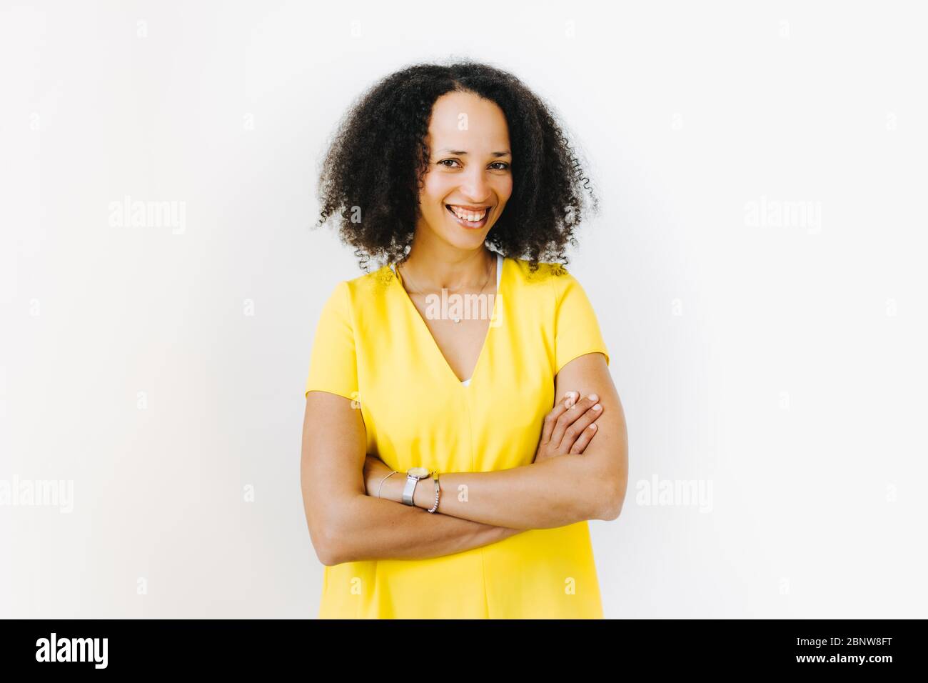 Portrait of cheerful black woman in yellow shirt Stock Photo - Alamy